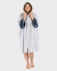 Adult female in studio wearing Dryrobe® Zip towel (nimbus cloud)