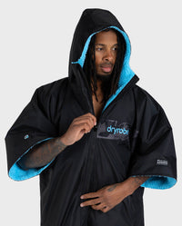 Adult Male in studio wearing black blue remix Dryrobe®