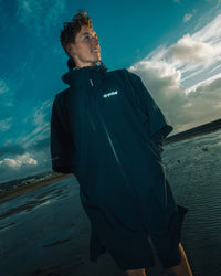 *MALE* standing by a lake wearing Tech-Lite Dryrobe®