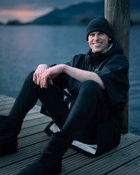*MALE* sitting beside lake wearing Tech-Lite Dryrobe®