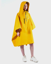 Girl wearing Yellow Kids dryrobe® Waterproof Poncho with hood up