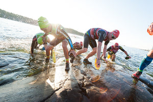 Swim runners getting out of the water at the ÖTILLÖ Race World Championships