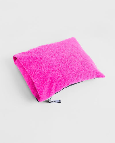 Studio Shot of Dryrobe® black pink cushion cover with LS Dryrobe® inside
