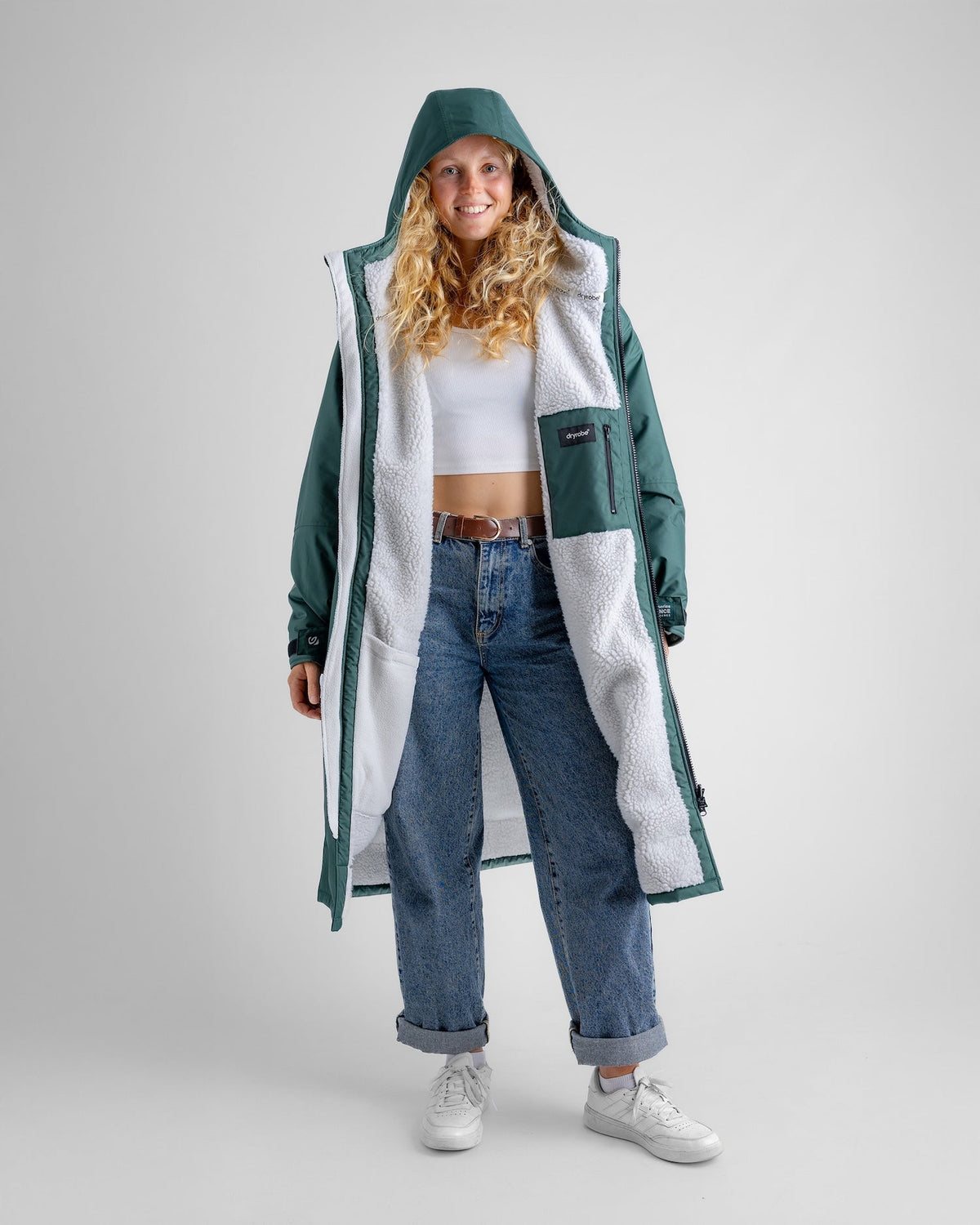 Female in studio wearing AW25 Green Dryrobe® advance long sleeve 