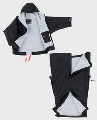 dryrobe® Adapt shown laid out, with the upper and lower part unzipped and separate 