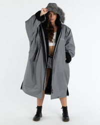 Woman wearing dryrobe Advance Long Sleeve Alpine Range change robe in Alpine Graphite