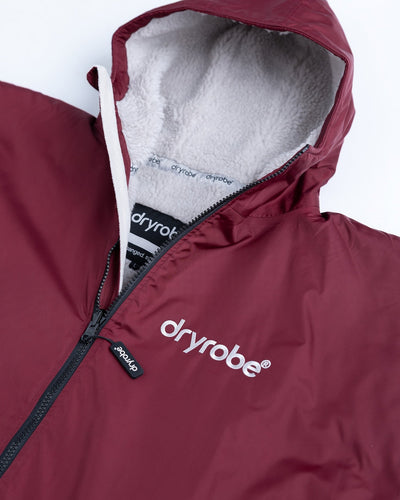 *MALE* Detail studio shot of AW25 Burgundy Dryrobe® advance long sleeve 