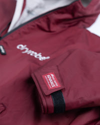 *MALE* Detail studio shot of AW25 Burgundy Dryrobe® advance long sleeve 