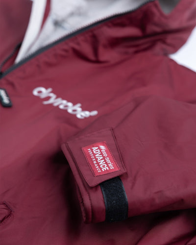 *MALE* Detail studio shot of AW25 Burgundy Dryrobe® advance long sleeve 