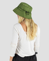 Woman with back to camera wearing dryrobe Fleece Lined Bucket Hat in Forest Green 