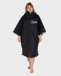 Adult female in studio wearing Dryrobe® black grey remix