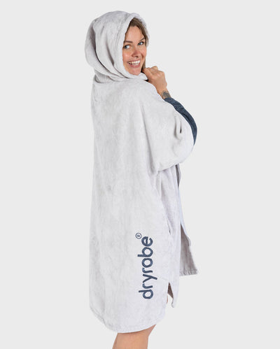 Adult female in studio wearing Dryrobe® Zip towel (nimbus cloud)