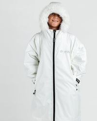 Boy wearing dryrobe Advance Long Sleeve Alpine Range changing robe in Alpine White with hood up 