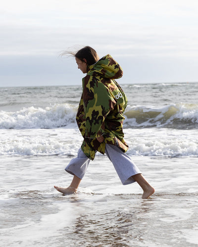 Kids camo grey Dryrobe® remix on beach 