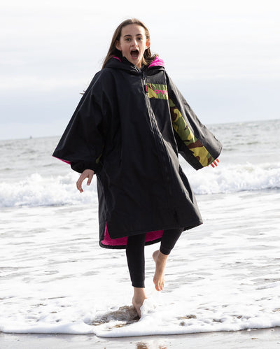 Kids black pink Dryrobe® remix on beach 