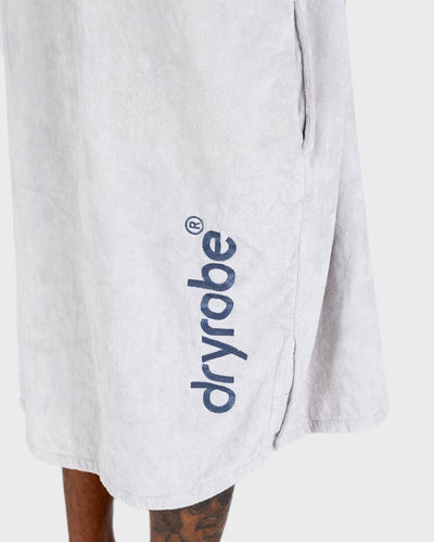 *MALE* in studio wearing Dryrobe® Zip towel (nimbus cloud)