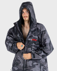 *MALE* wearing Black Camo dryrobe® Advance Long Sleeve with hood up 