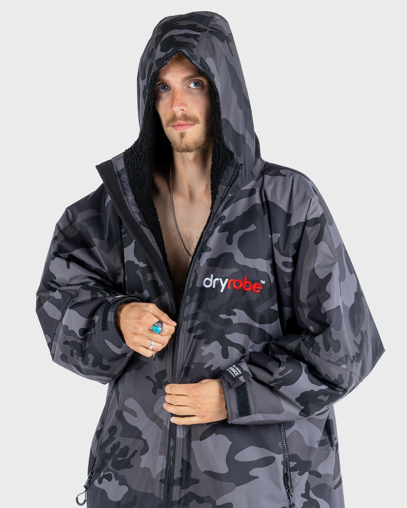 *MALE* wearing Black Camo dryrobe® Advance Long Sleeve with hood up 