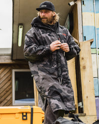 *MALE* dryrobe® ambassador Ben Skinner wearing Black Camo dryrobe® Advance Long Sleeve