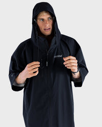 *MALE* wearing dryrobe® Lite changing robe with hood up