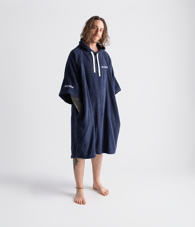 *MALE* Person wearing a navy blue hooded towel robe on a white background