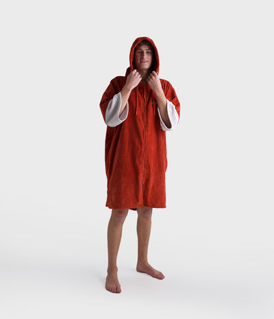 *MALE* Person wearing a red hooded towel on a white background