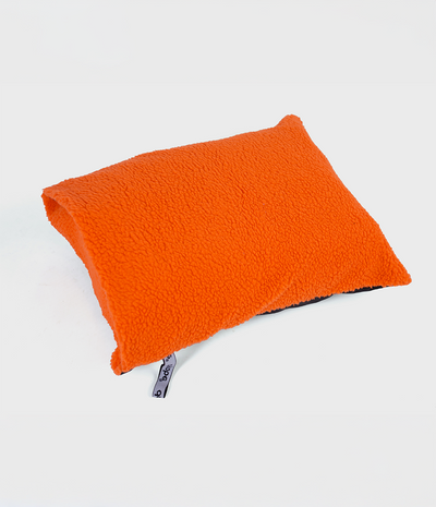 Black and orange cushion cover with Dryrobe® logo on a white background showing orange fleece inside and filled