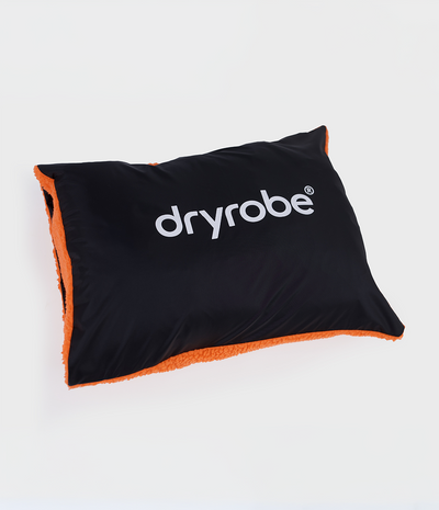 Black and orange cushion cover with Dryrobe® logo on a white background showing black outer.