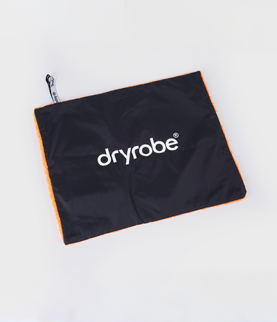 Black and orange cushion cover with Dryrobe® logo on a white background