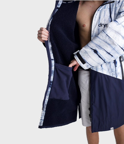 *MALE* Person wearing a blue and white Dryrobe with 'dryrobe' branding on a light grey background