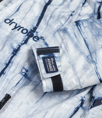 *MALE* White and blue patterned Dryrobe with a black strap and visible branding on a white background