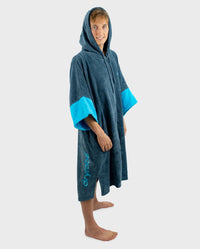 *MALE* Person wearing a blue hooded towel with turquoise sleeves on a white background