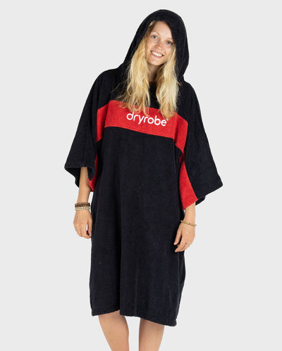 Woman wearing Organic Towel dryrobe Remix in Black Red with hood up 