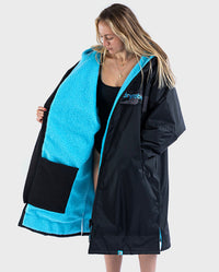 Woman wearing Black Blue Camo dryrobe® Advance REMIX Range, unzipped