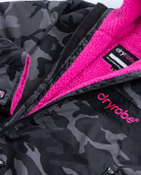 Close up of logo on dryrobe Advance Long Sleeve REMIX Range change robe in Black Camo Pink Black