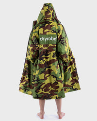 Woman stood with back to camera, wearing dryrobe Advance Long Sleeve REMIX Range change robe in Camo Grey Green