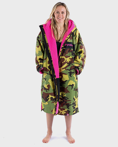 Woman wearing dryrobe Advance Long Sleeve REMIX Range change robe in Camo Pink Black