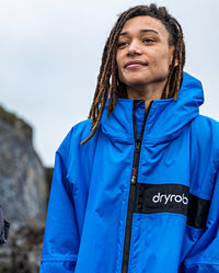 Close up of man wearing Cobalt Blue Black dryrobe® Advance Long Sleeve REMIX Range