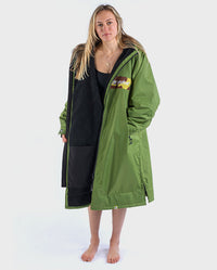 Woman wearing dryrobe Advance Long Sleeve REMIX Range change robe in Forest Green Black Camo