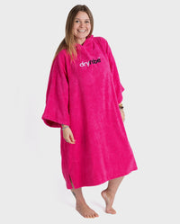 Woman smiling wearing dryrobe® Organic Cotton Towel Robe in Pink