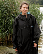 Close up of woman wearing Stay Wild dryrobe® Advance