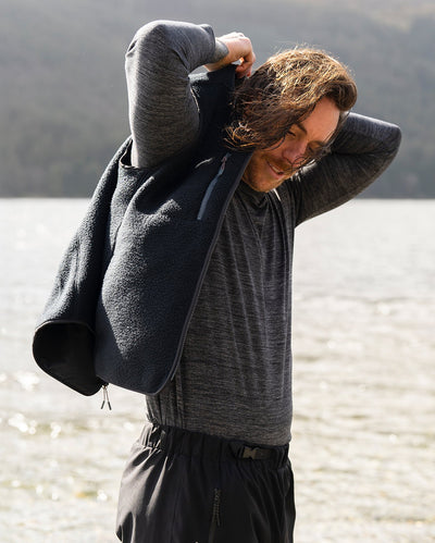 **MALE** Male in Dryrobe® fleece gilet in front a lake 