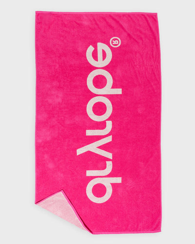 Flat studio shot of pink Dryrobe® beach towel 