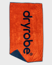 dryrobe® Beach Towel in Orange Deep Sea Blue, laid out flat showing Orange side