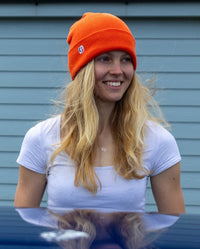 Woman wearing Orange dryrobe Beanie