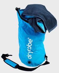 dryrobe Compression Travel Bag in Blue showing towel inside 