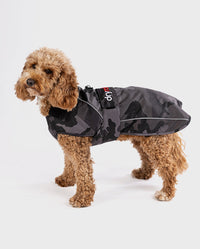 Cockapoo standing wearing Black Camo dryrobe® Dog