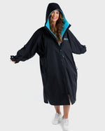 Woman wearing Black Blue dryrobe® Advance Long Sleeve with hood up