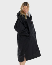 Woman wearing Black Grey dryrobe® Advance zipped up