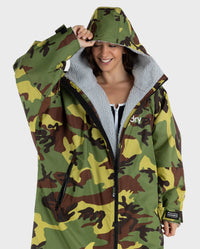 Woman wearing Camo Grey dryrobe® Advance Long sleeve with hood up